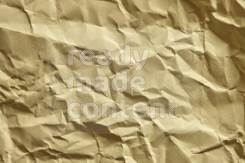 Crumpled craft paper on black background