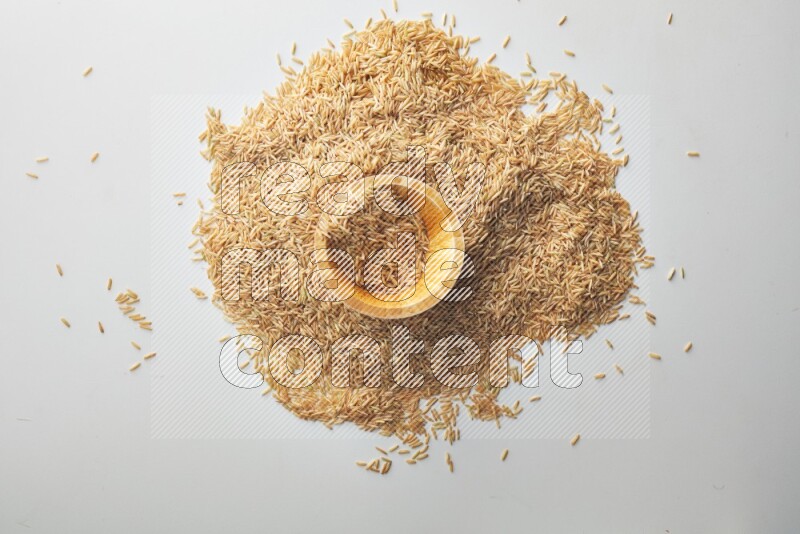 Long grain brown rice on white background