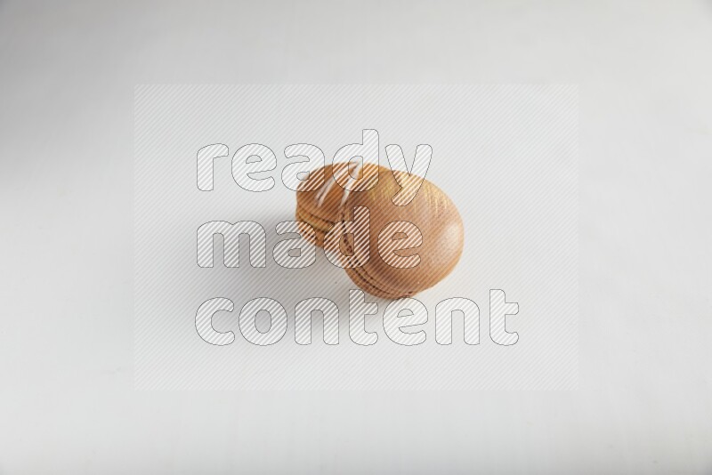 45º Shot of of two assorted Brown Irish Cream, and Brown Coffee macarons  on white background