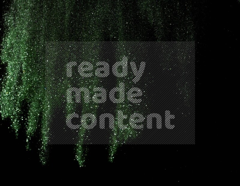 Green glitter powder isolated on black background