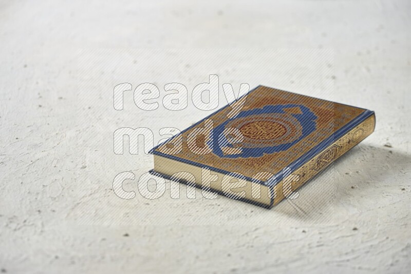 Quran with dates, prayer beads and different drinks all placed on textured white background