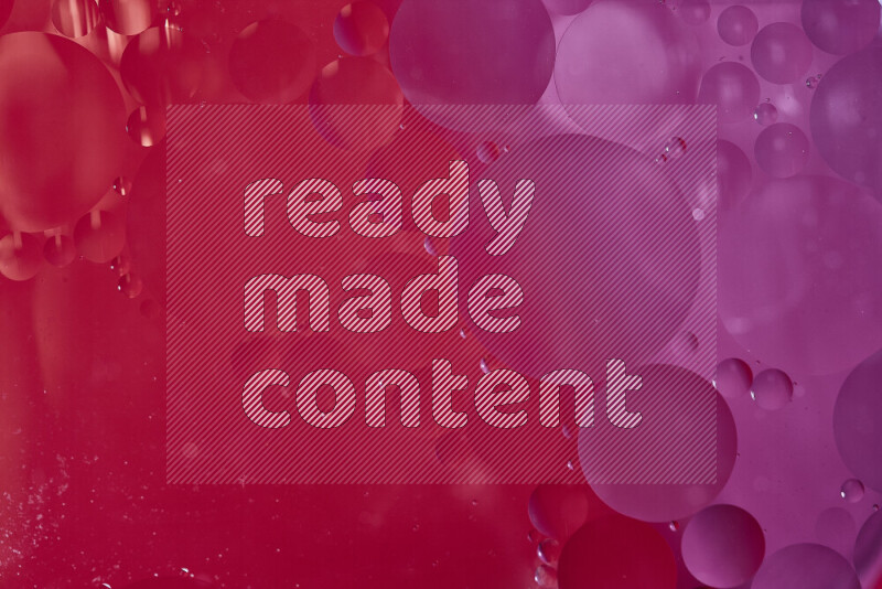 Close-ups of abstract oil bubbles on water surface in shades of red and pink