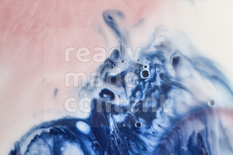 A close-up of abstract swirling patterns in blue, red and white