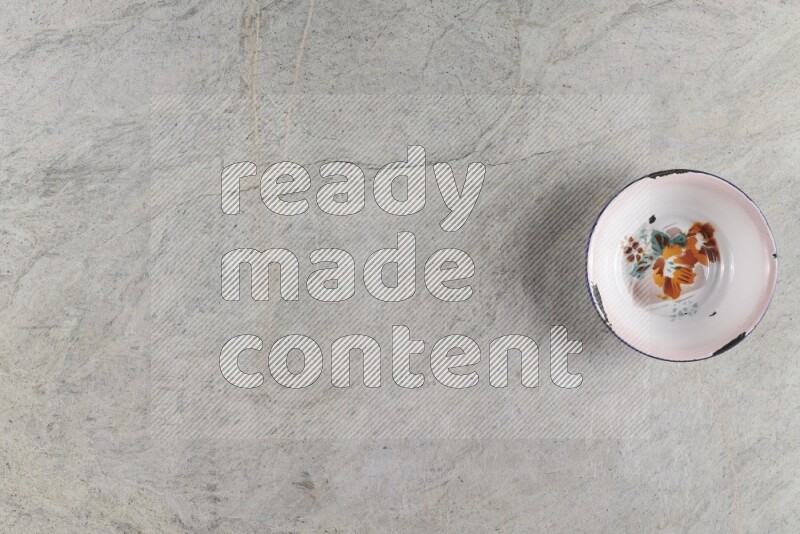 A vintage metal plate on grey marble background