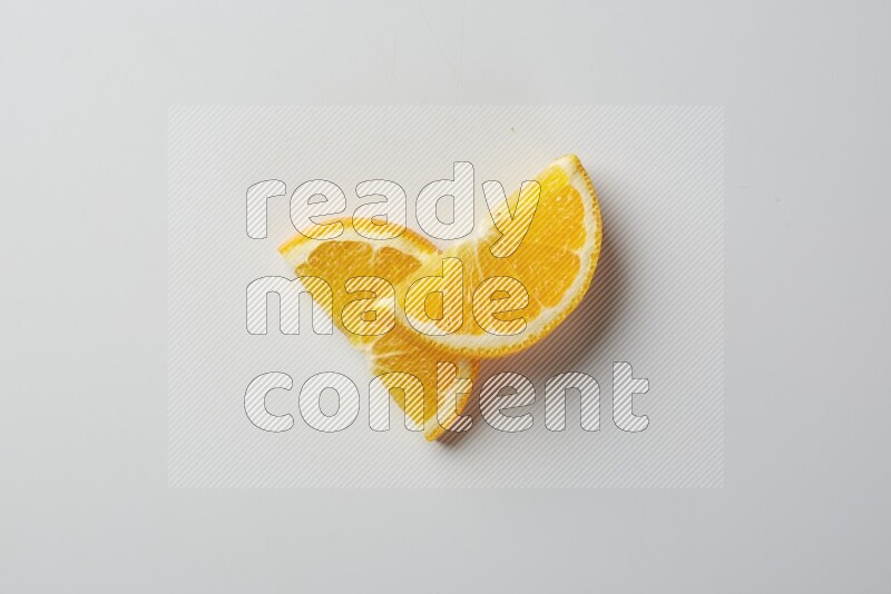Two halves of an orange slices on white background