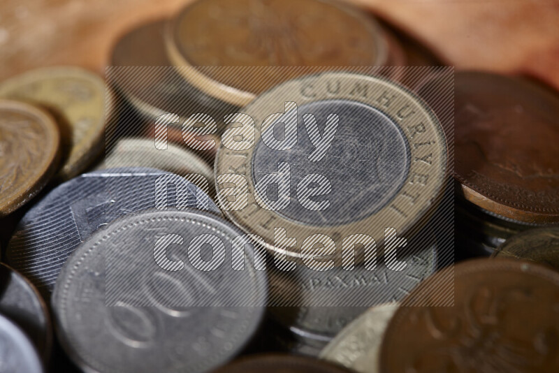 A close-ups of random old coins on black background