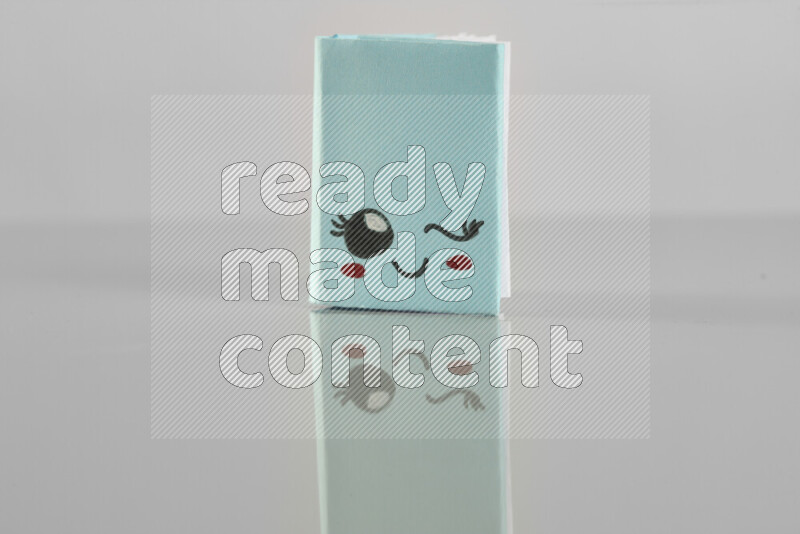 Origami book on grey background