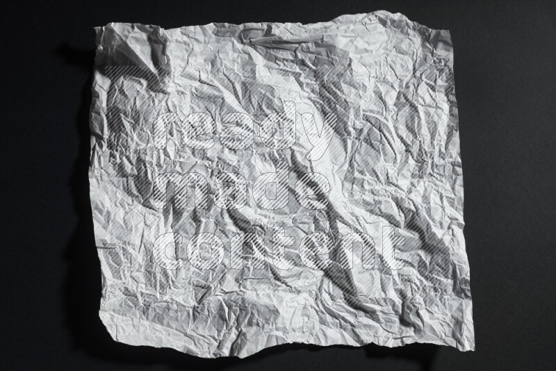 White paper sheet on black background