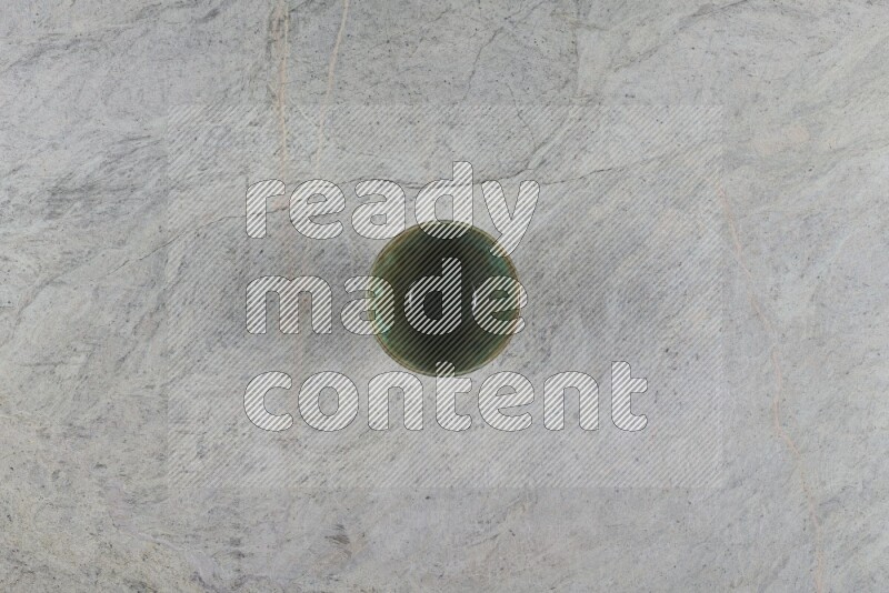 A multicolored pottery Bowl on grey marble background