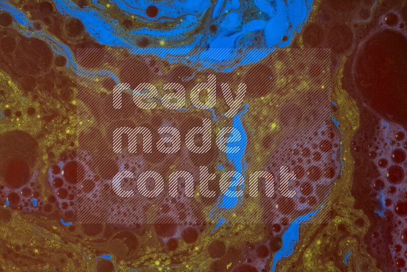 The image depicts a marbling effect with swirling patterns of red, blue and yellow