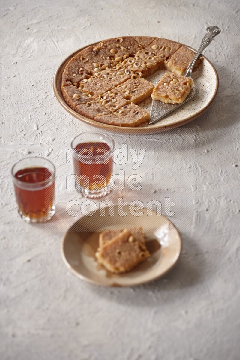 Basbousa with tea in a light setup