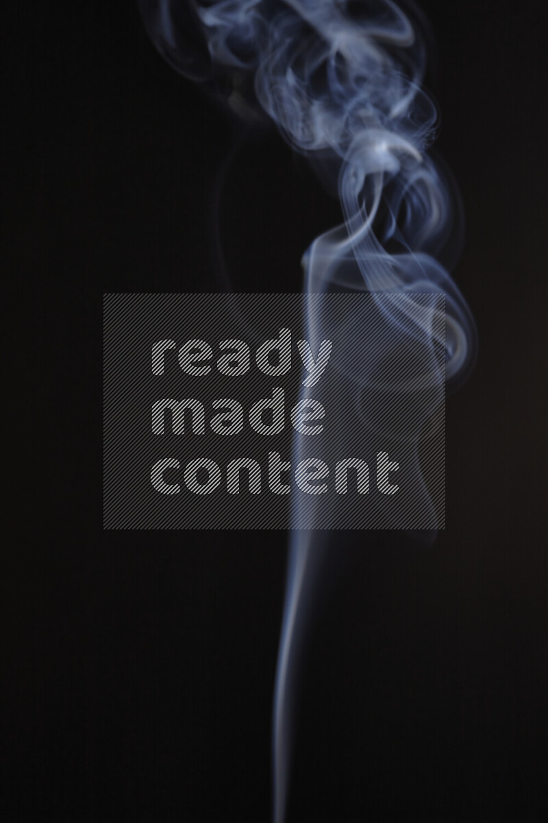 Motion of wavy smoke isolated on dark background