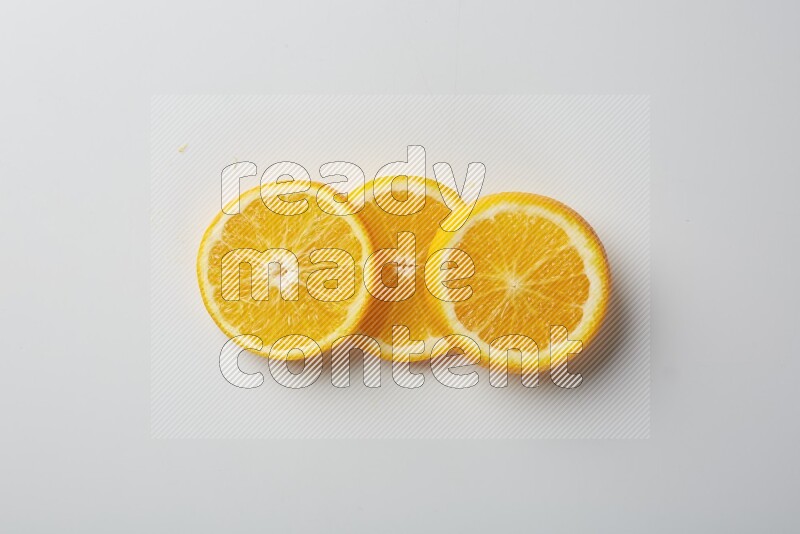 Three orange slices on a white background