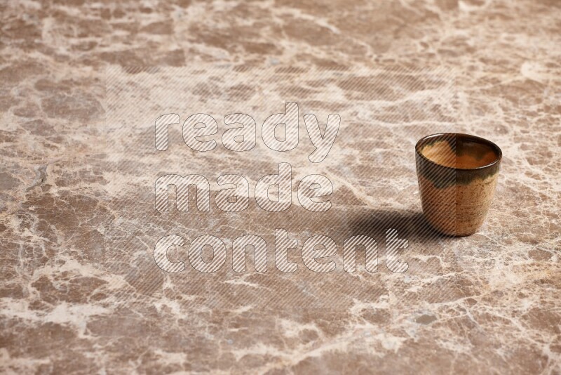 Pottery Cup on Beige Marble Flooring