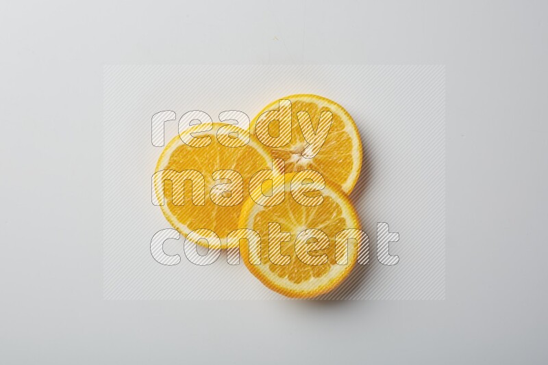 Three orange slices on a white background