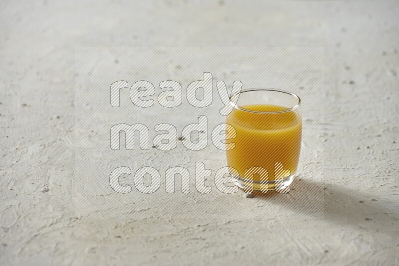 Cold drinks in a glass cup such as water, tamarind, qamar eldin, sobia, milk and hibiscus on textured white background