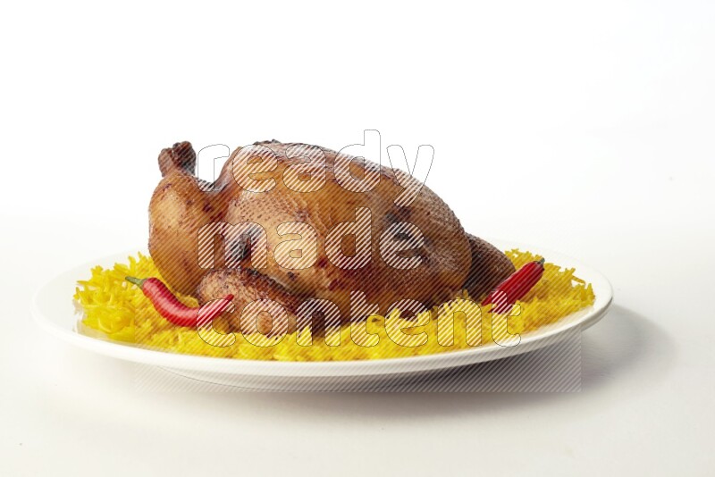 yellow  basmati Rice with  whole roasted chicken on a white rounded plate direct on white background