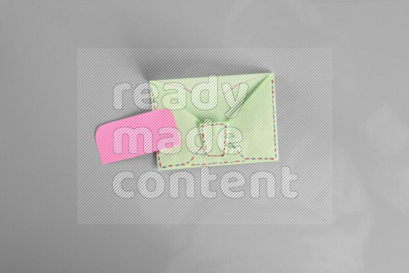 Origami envelope on grey background