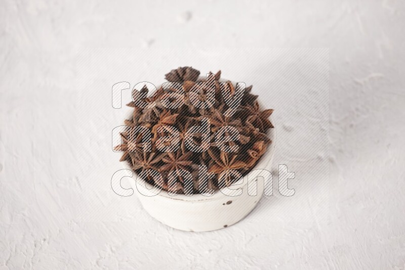 Star Anise in a white bowl on white background