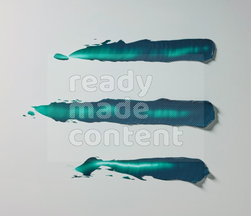 Turquoise painting knife strokes on white background