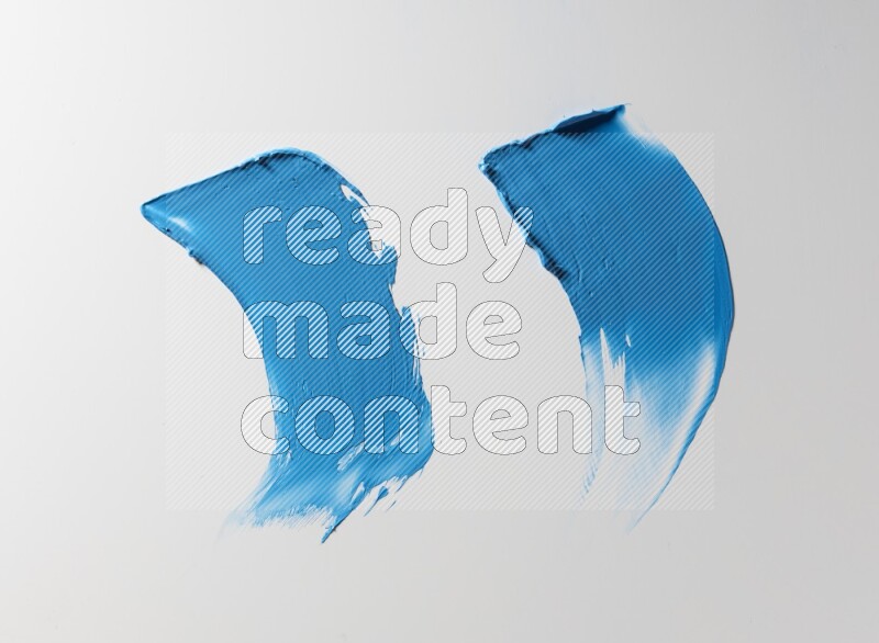 Blue curved painting knife strokes on white background
