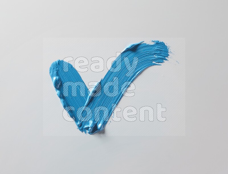 Multi blue straight brush strokes in different shapes on a white background