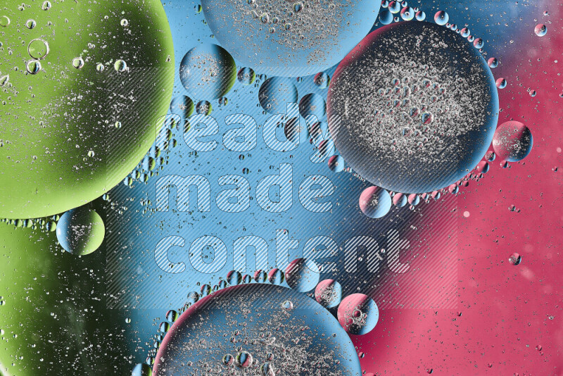 Close-ups of abstract oil bubbles on water surface in shades of pink, green and blue