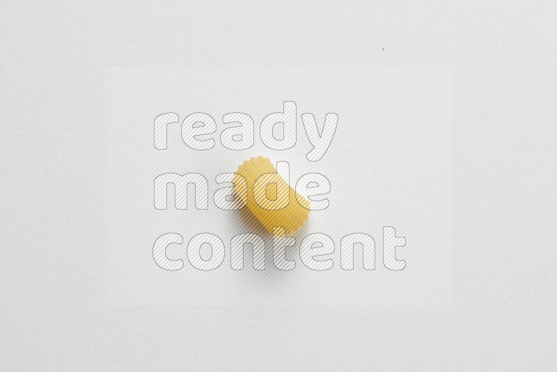 Elbow pasta on white background