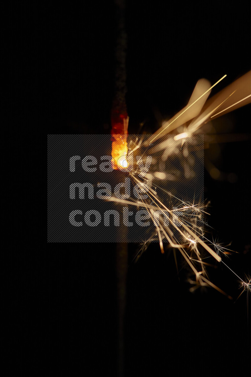 A close-up image of sparkler candle isolated on black background