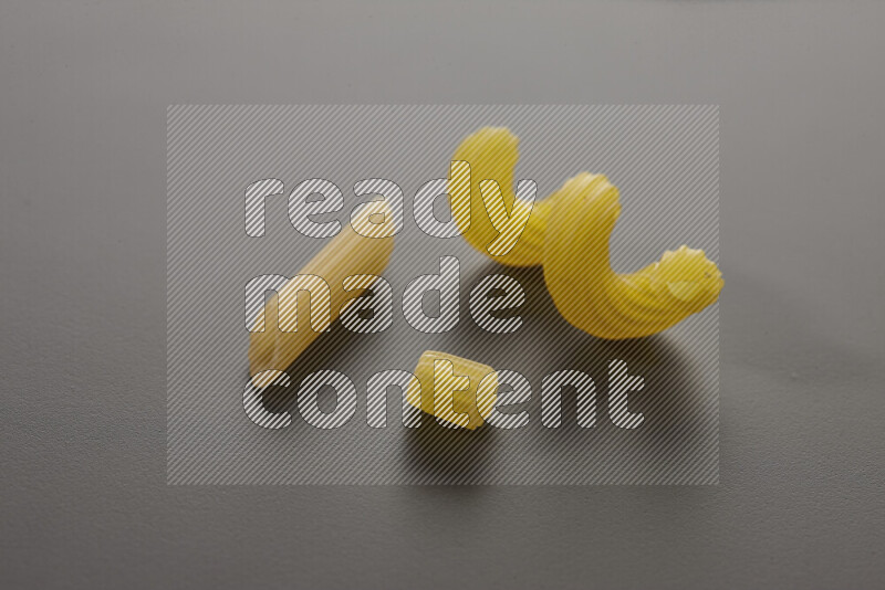 Different pasta types on grey background