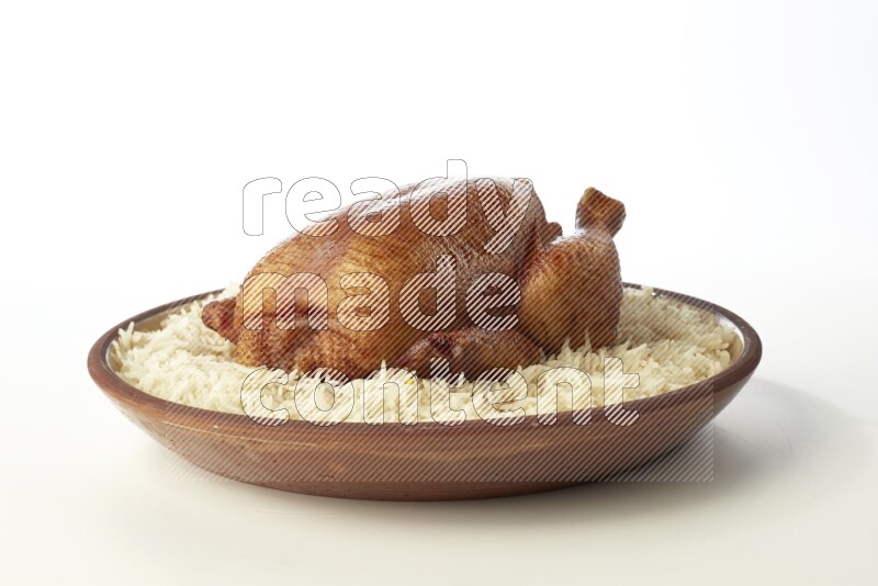 white  basmati Rice with  whole roasted chicken    on a pottery plate  direct  on white background