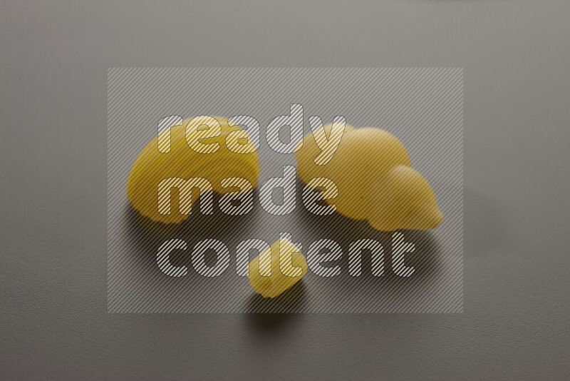 Different pasta types on grey background