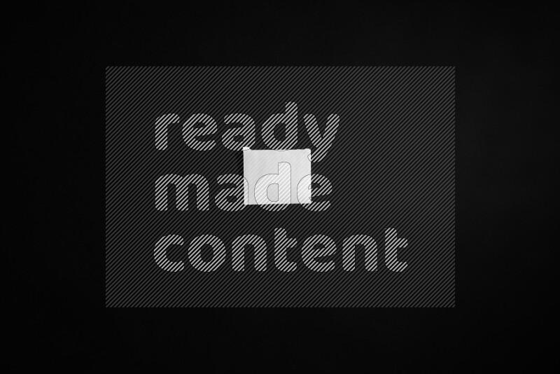 Ripped notebook sheet on black background