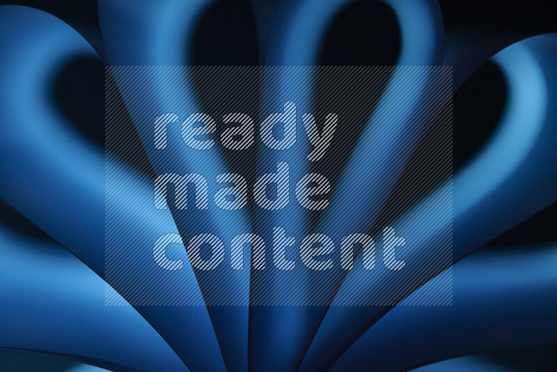 فن تجريدي يعرض منحنيات وتدرجات اللون الأزرق مكونه بضوء ملون