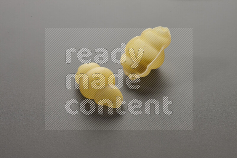 Snails pasta on grey background