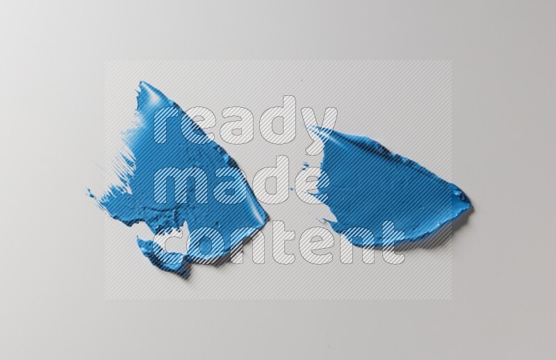 Blue painting knife strokes on white background