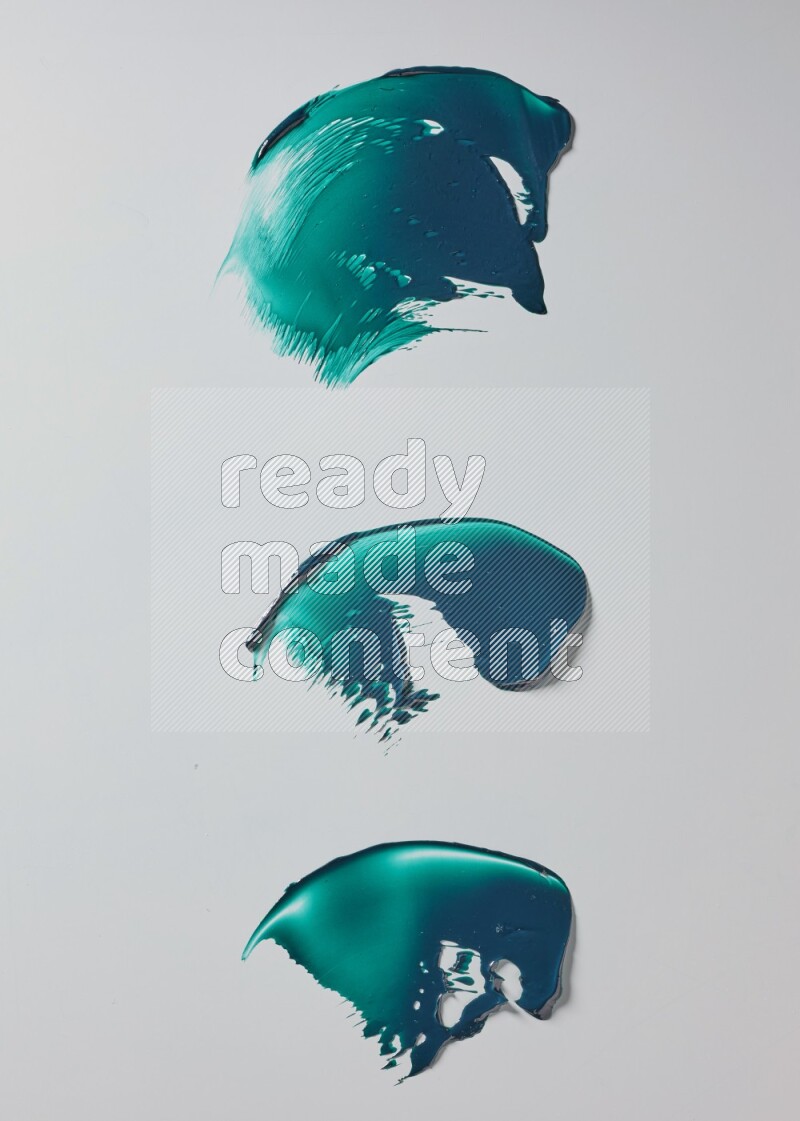 Turquoise painting knife strokes on white background
