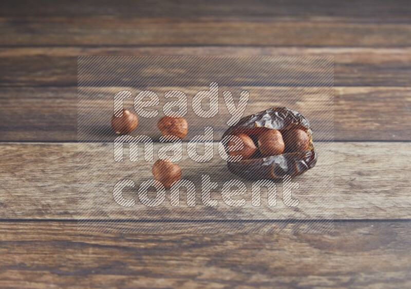 hazelnut stuffed madjoul date on a wooden background