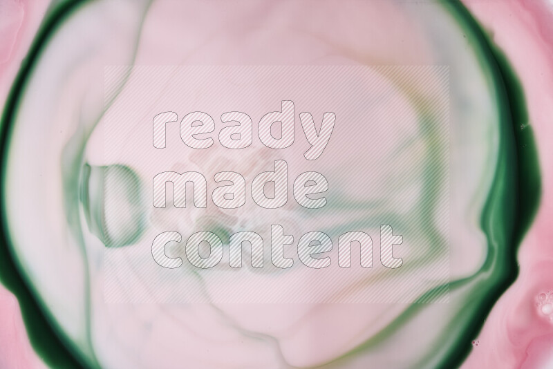 A close-up of abstract swirling patterns in red and green