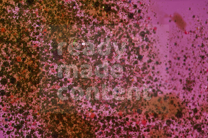 Close-ups of abstract green and red watercolor drops on oil Surface on pink background