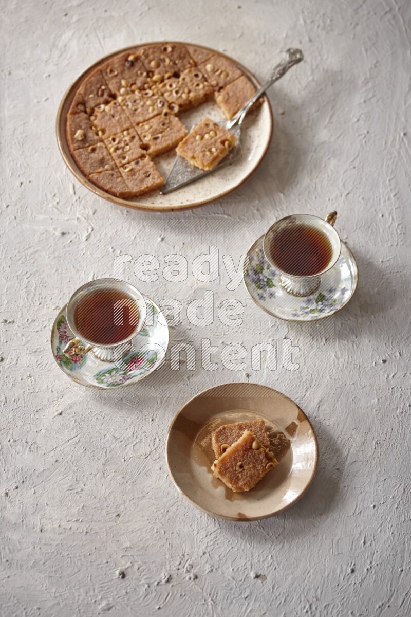 Basbousa with tea in a light setup