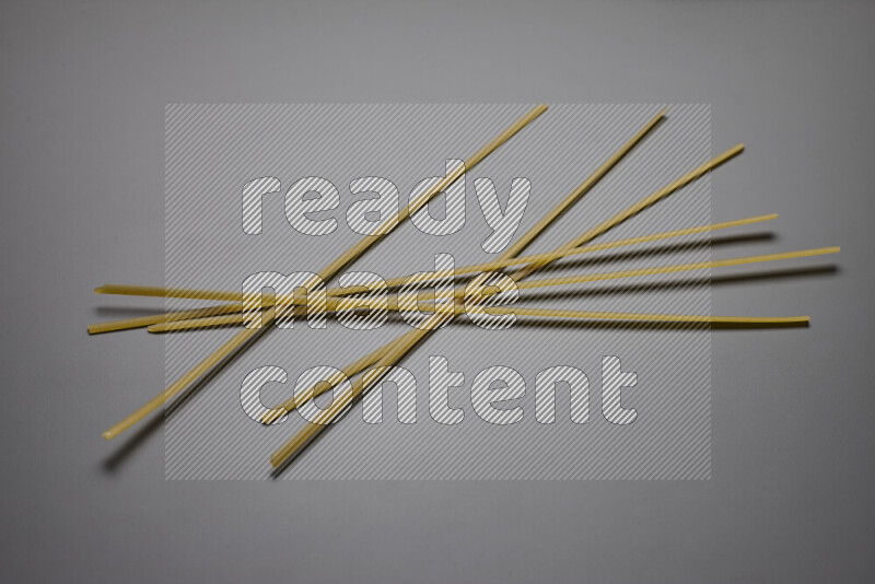 Linguini pasta on grey background