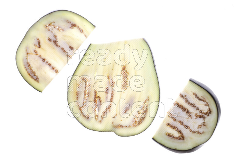 Eggplant slices on illuminated white background