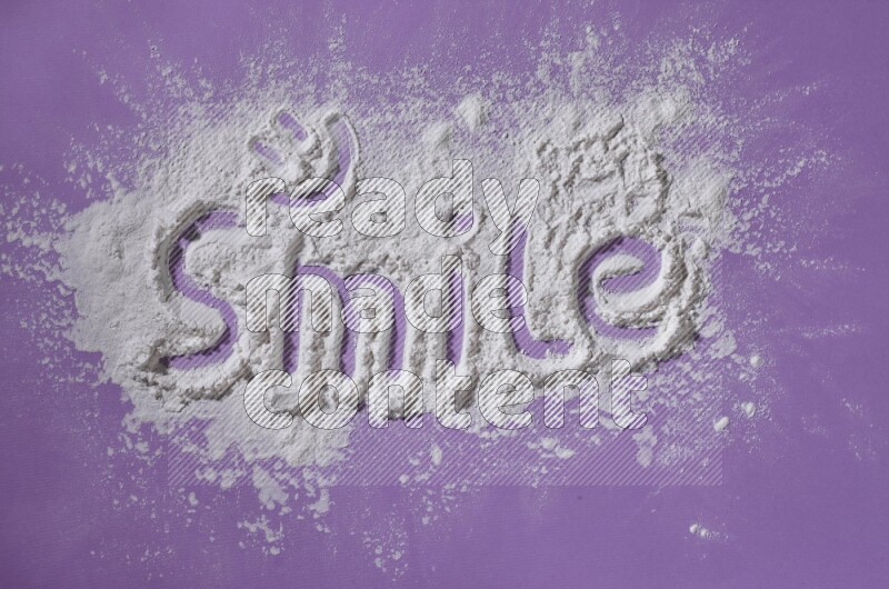 A word written with white powder on purple background