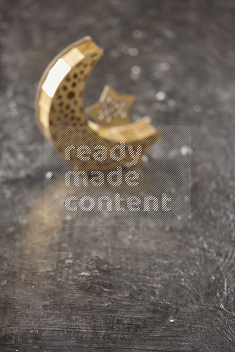 A lantern placed on a textured black background