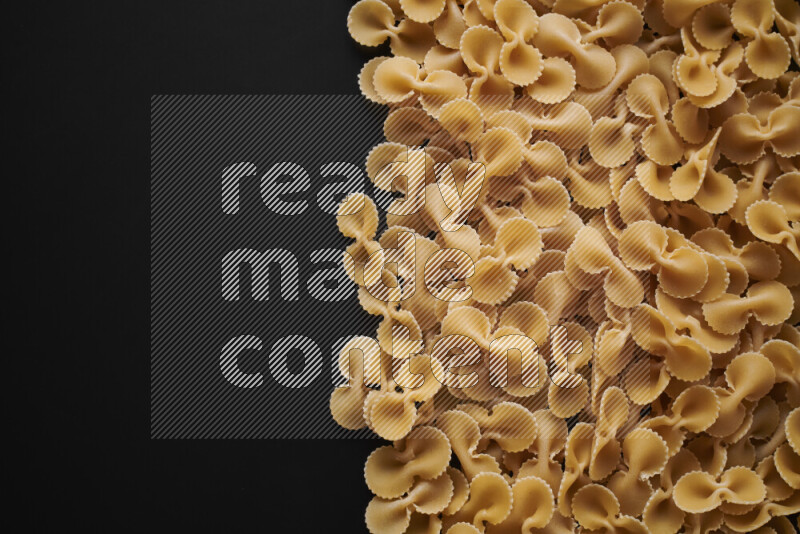 Different pasta types on black background