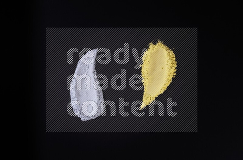 أشكال من المسحوق متعددة الألوان على خلفية سوداء