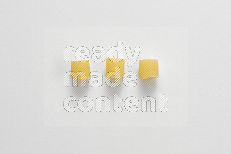 Big rings pasta on white background