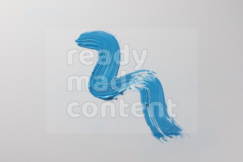A single blue zigzag brush stroke on a white background
