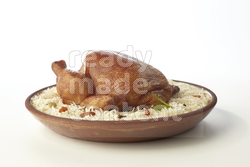 white  basmati Rice with  whole roasted chicken    on a pottery plate  direct  on white background